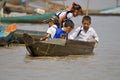 Young children go to school in boatÃÂ on the Tonle sap River Royalty Free Stock Photo